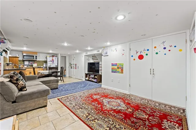 a living room with furniture and a rug