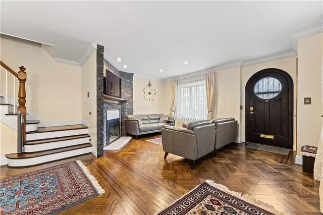 a living room with furniture and a rug