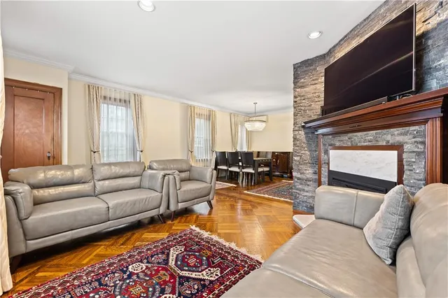 a living room with furniture wooden floor and a fireplace