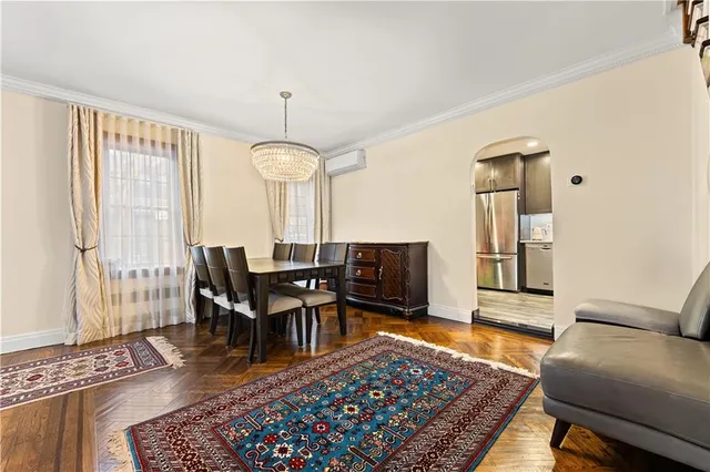 a living room with furniture rug and window