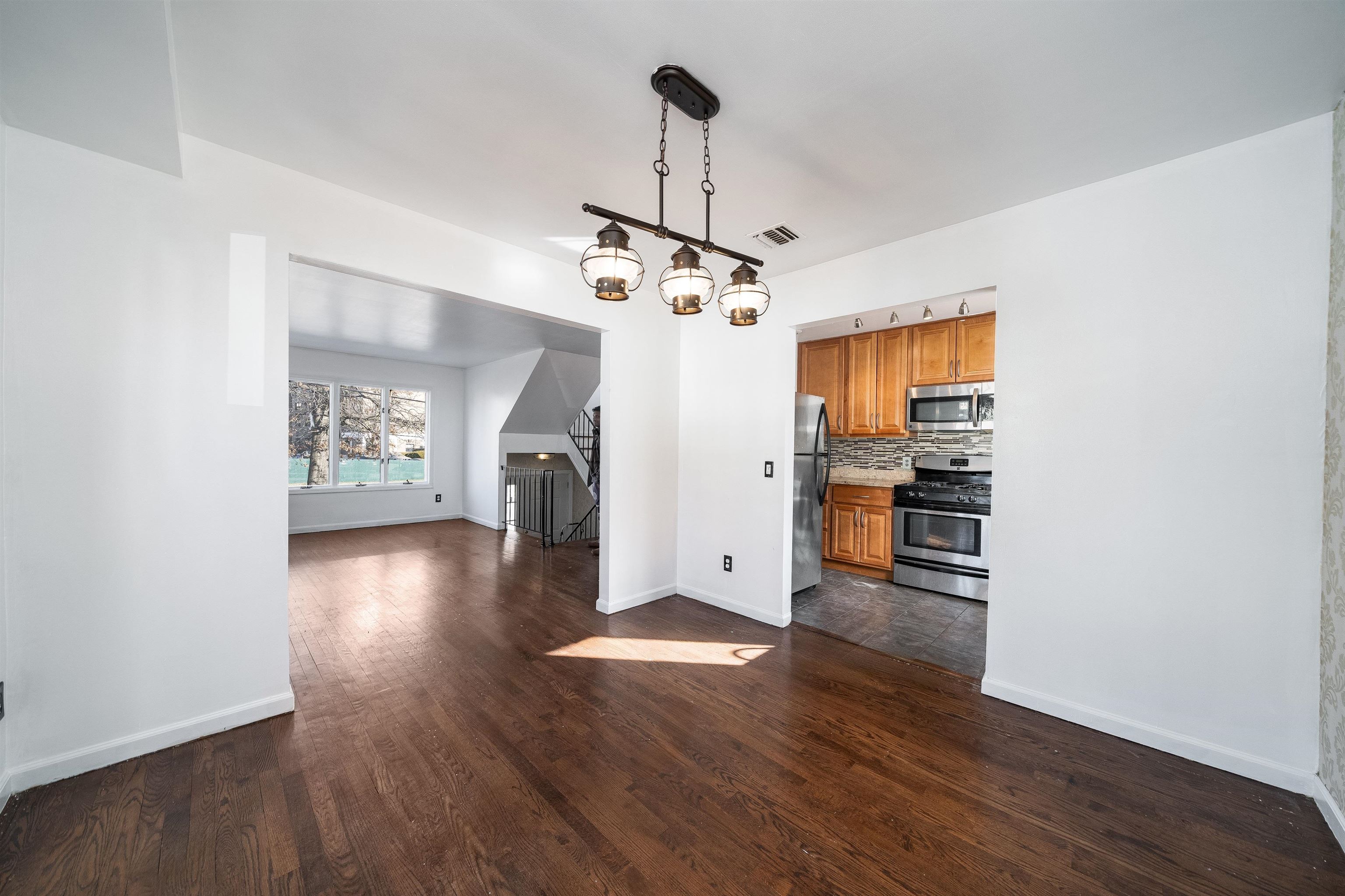156 Main Street East Rutherford, NJ 07073 - Photo 4 of 19 a view of a kitchen with a sink and a window