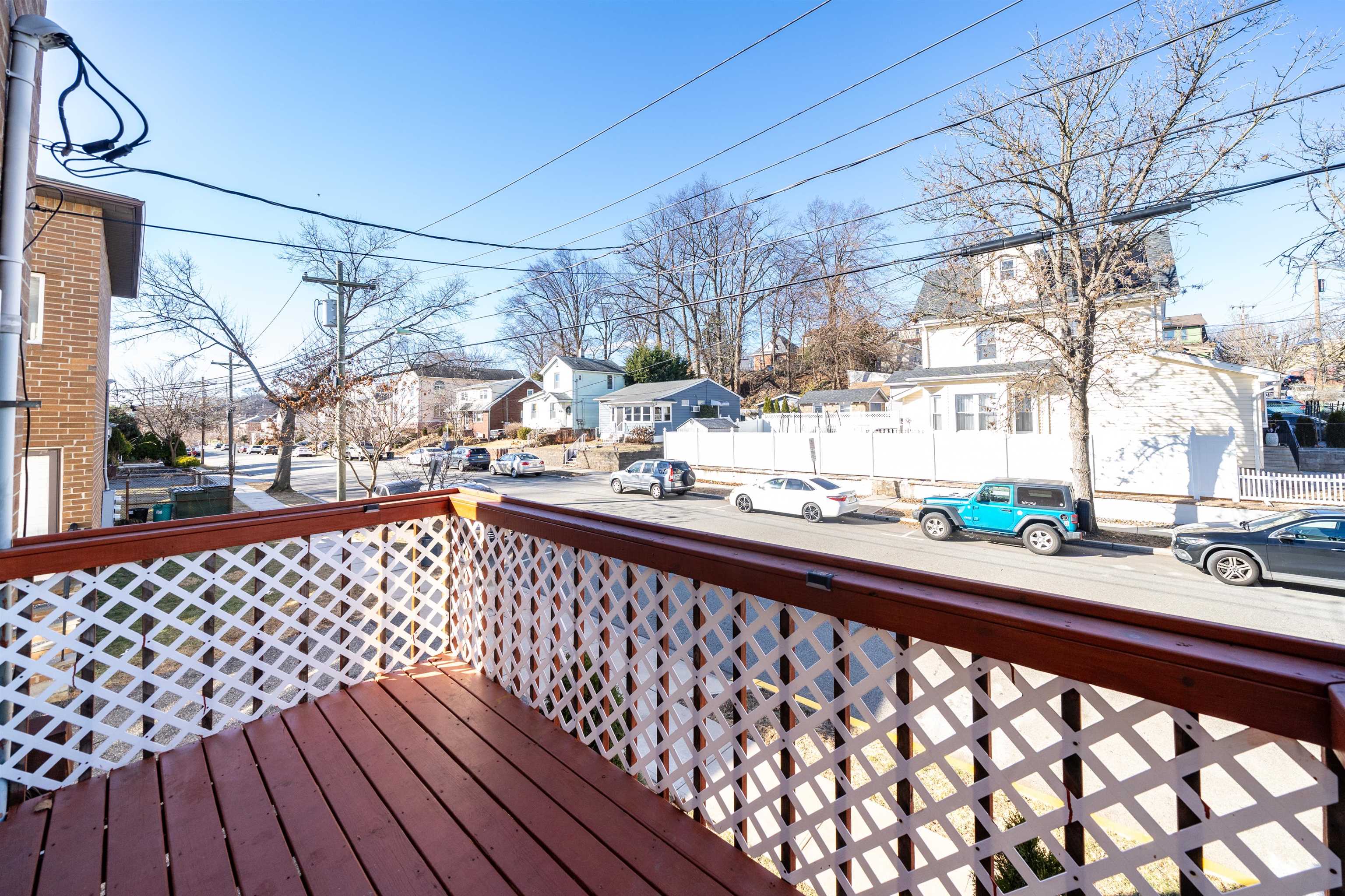 156 Main Street East Rutherford, NJ 07073 - Photo 9 of 19 a view of a balcony with wooden fence