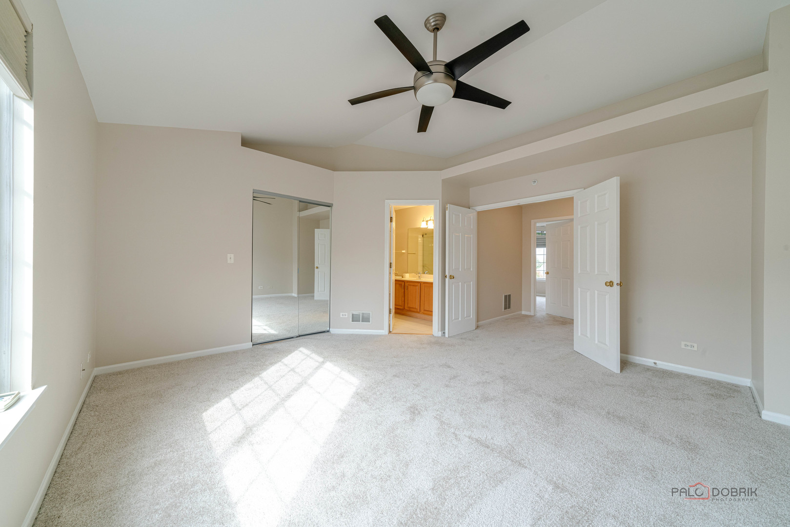 1719 Sienna Court Wheeling, IL 60090 - Photo 23 of 34 a view of a livingroom with a ceiling fan and window