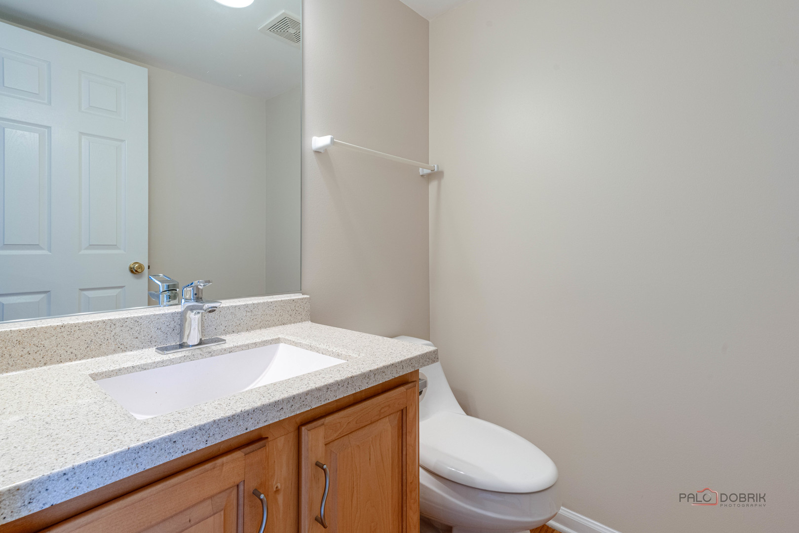 1719 Sienna Court Wheeling, IL 60090 - Photo 31 of 34 a bathroom with a sink a toilet and a mirror