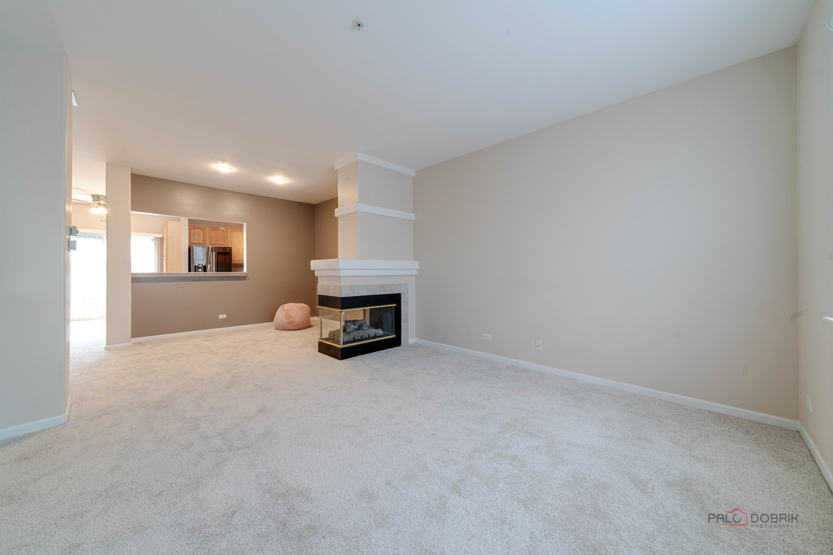 1719 Sienna Court Wheeling, IL 60090 - Photo 7 of 34 an empty room with furniture and a fireplace