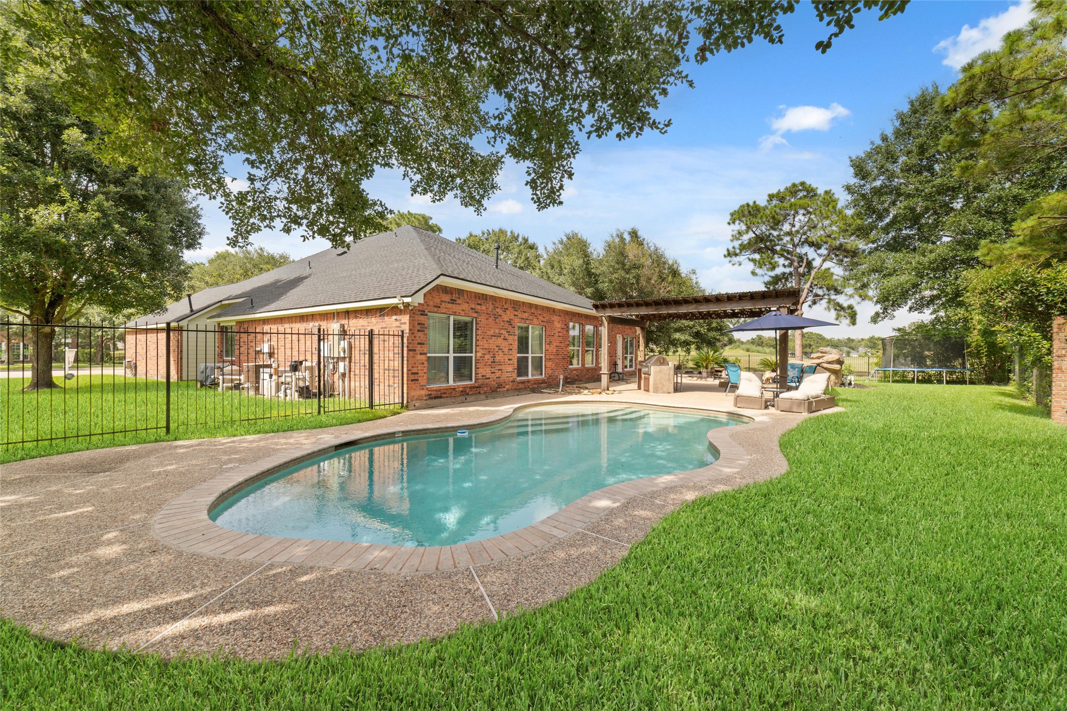 24203 Moon Ridge Court Katy, TX 77494 - Photo 37 of 43 Another view of the backyard looking towards the golf course!