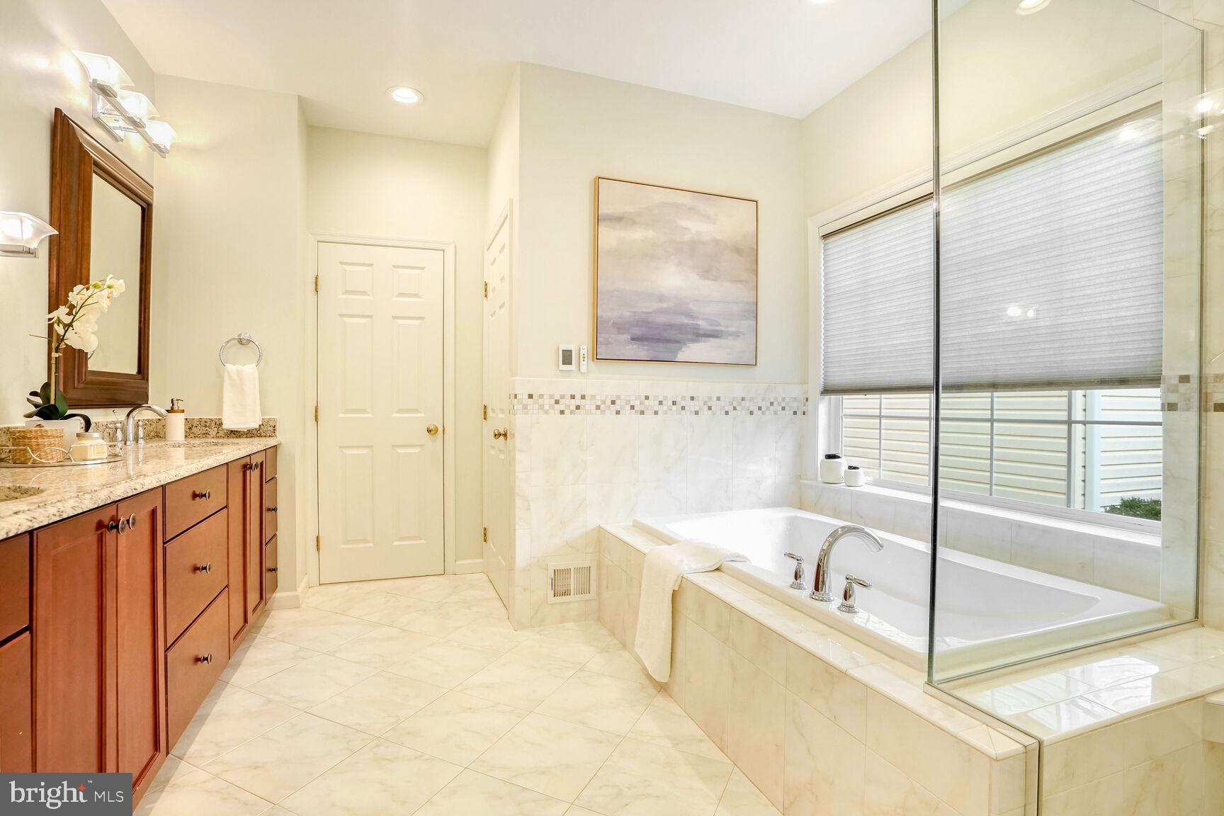2459 Arctic Fox Way Reston, VA 20191 - Photo 22 of 45 Primary Bathroom with heated floors walk-in closet