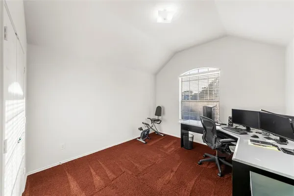 a workspace with furniture and a window
