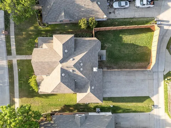 an aerial view of a house with a yard pool outdoor seating and yard
