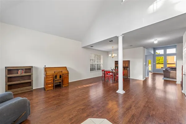 a view of a livingroom with furniture and a ceiling fan
