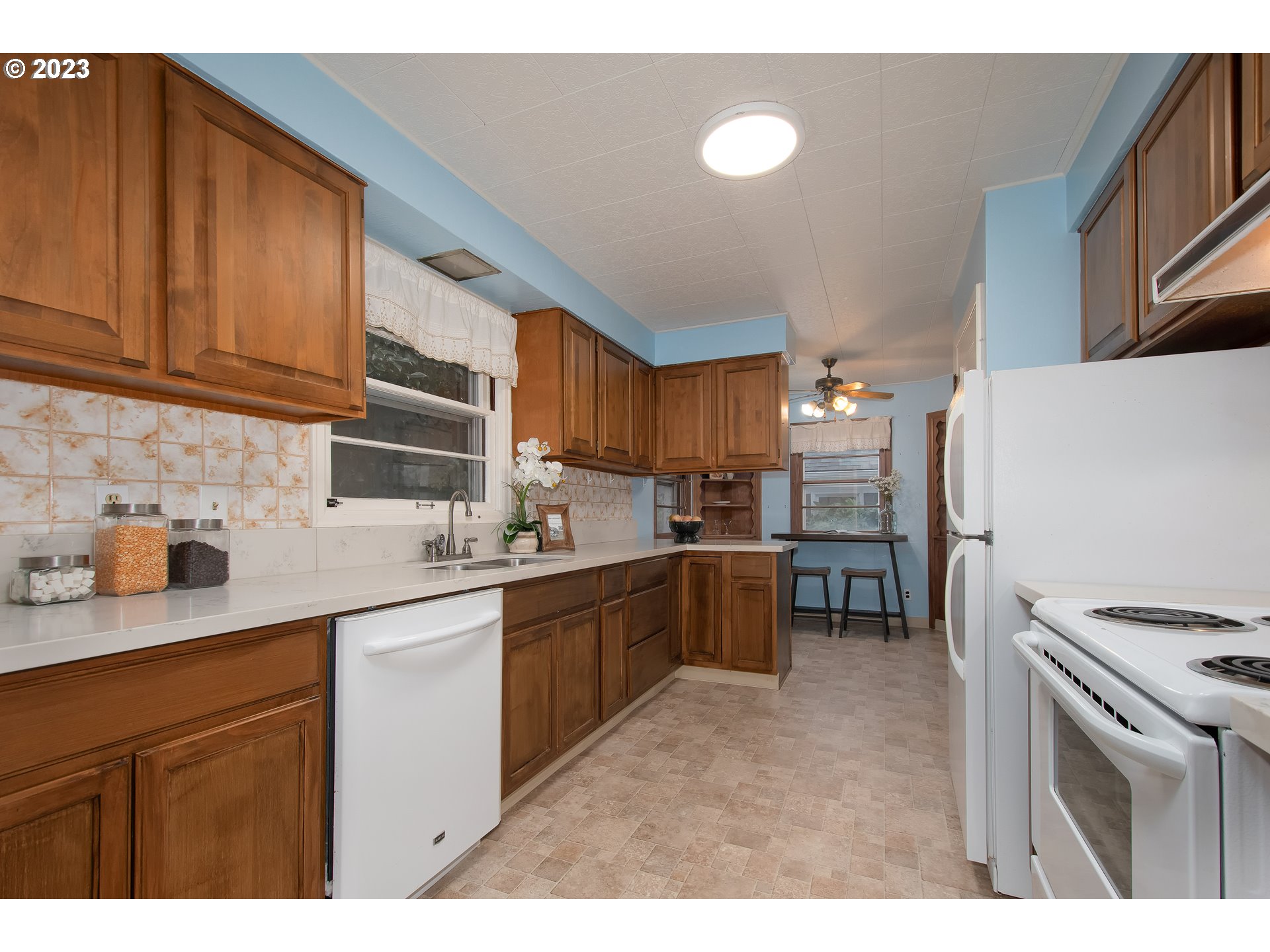 110 Northwest 12th Street Gresham, OR 97030 - Photo 13 of 43 a kitchen with refrigerator and cabinets