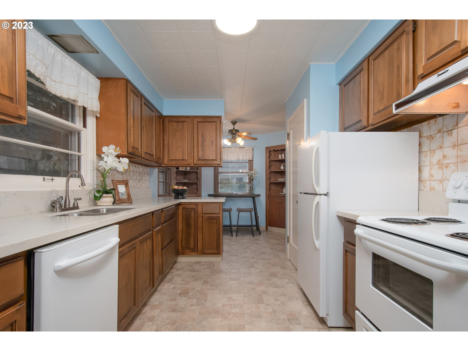 110 Northwest 12th Street Gresham, OR 97030 - Photo 14 of 43 a kitchen with refrigerator cabinets and a sink
