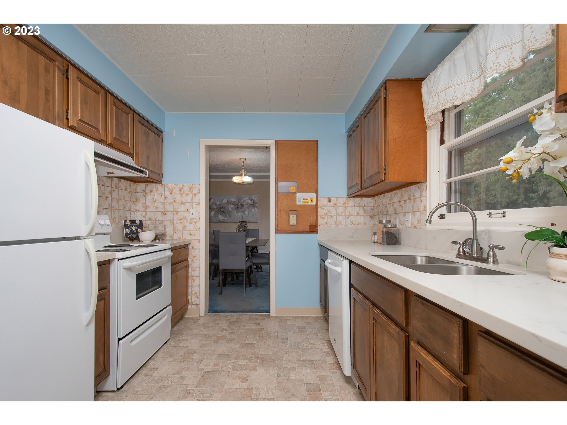 110 Northwest 12th Street Gresham, OR 97030 - Photo 18 of 43 a kitchen with a sink stove and refrigerator
