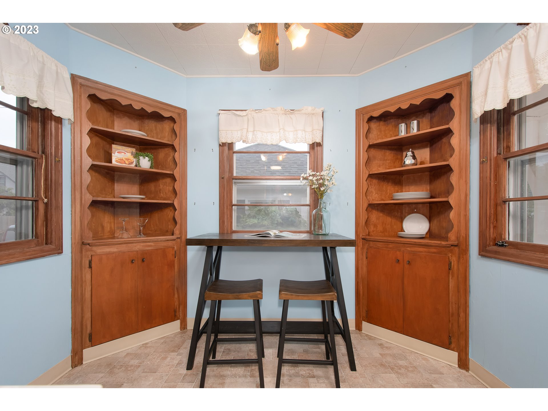 110 Northwest 12th Street Gresham, OR 97030 - Photo 19 of 43 a dining room table chair cabinet and a window
