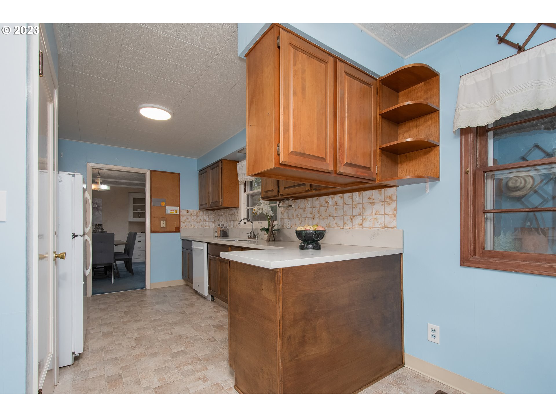 110 Northwest 12th Street Gresham, OR 97030 - Photo 22 of 43 a kitchen with stainless steel appliances granite countertop a sink a stove and a refrigerator