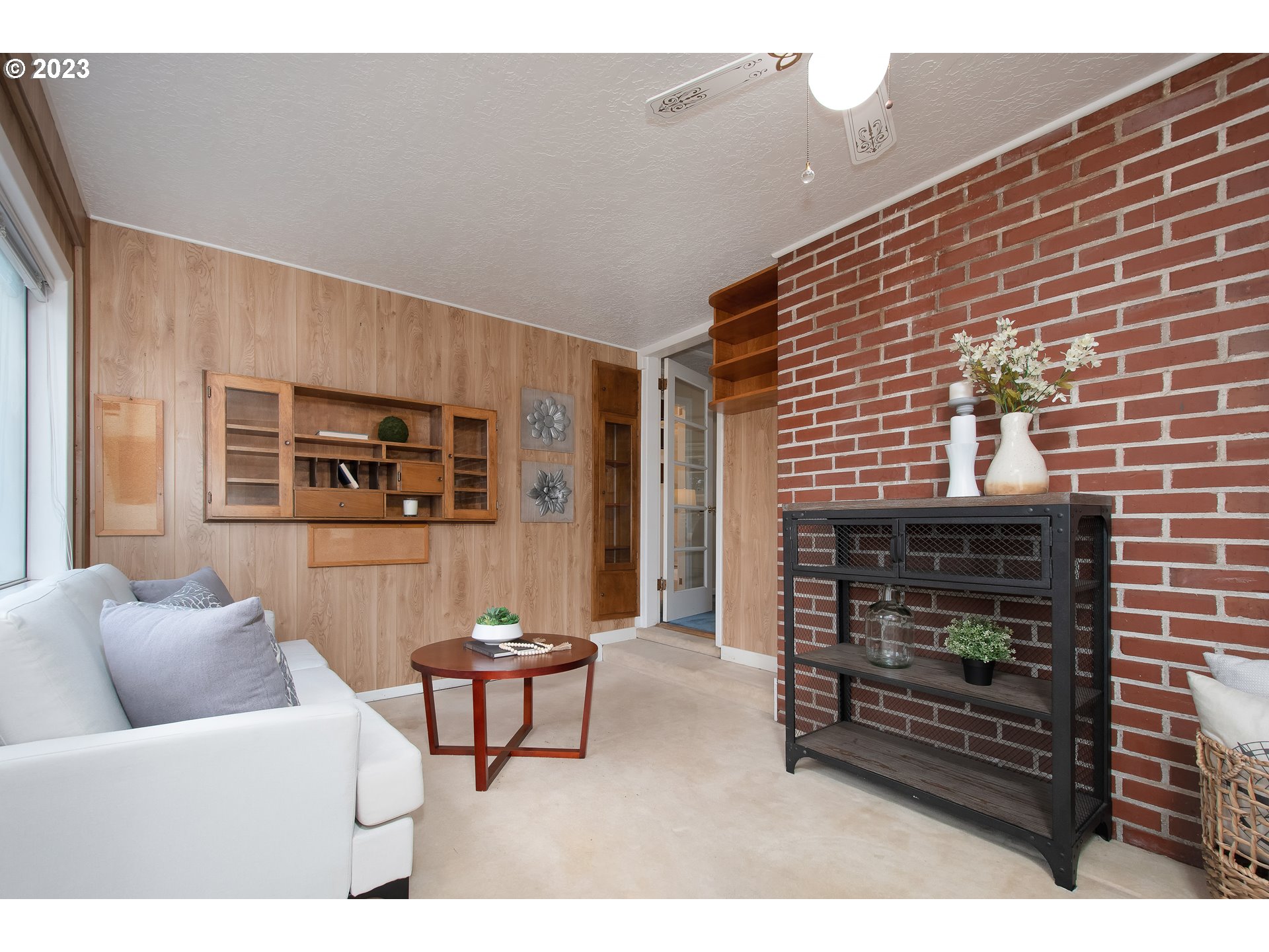 110 Northwest 12th Street Gresham, OR 97030 - Photo 24 of 43 a living room with furniture a fireplace and a table