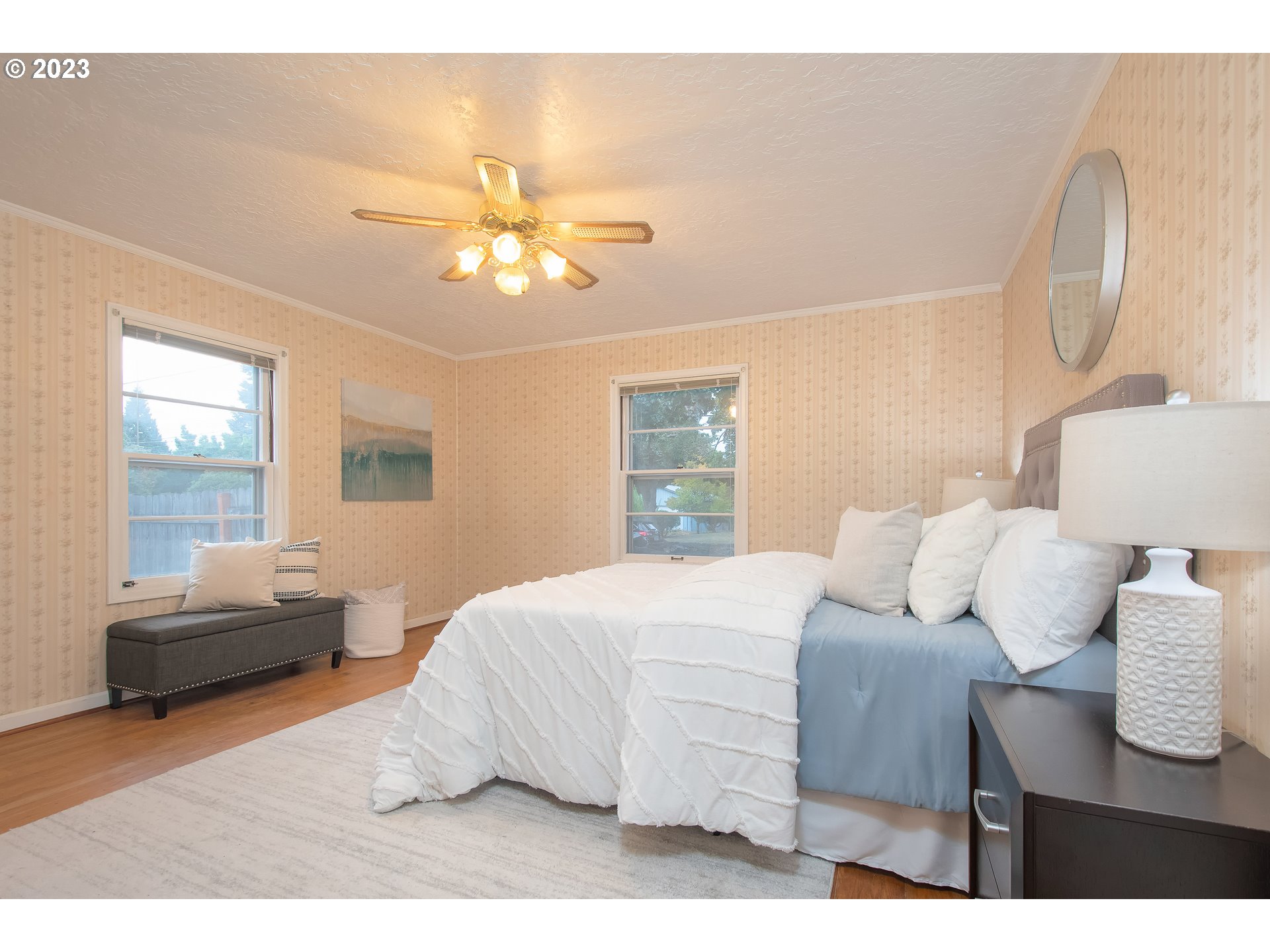 110 Northwest 12th Street Gresham, OR 97030 - Photo 27 of 43 a bedroom with a bed ceiling fan and a window