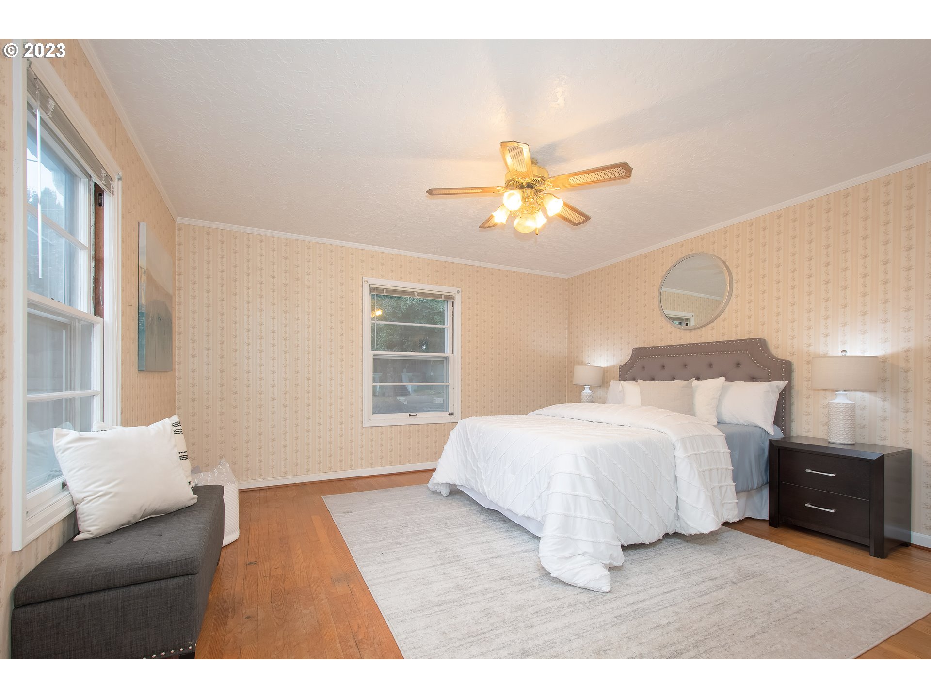 110 Northwest 12th Street Gresham, OR 97030 - Photo 28 of 43 a bedroom with a bed and a chandelier