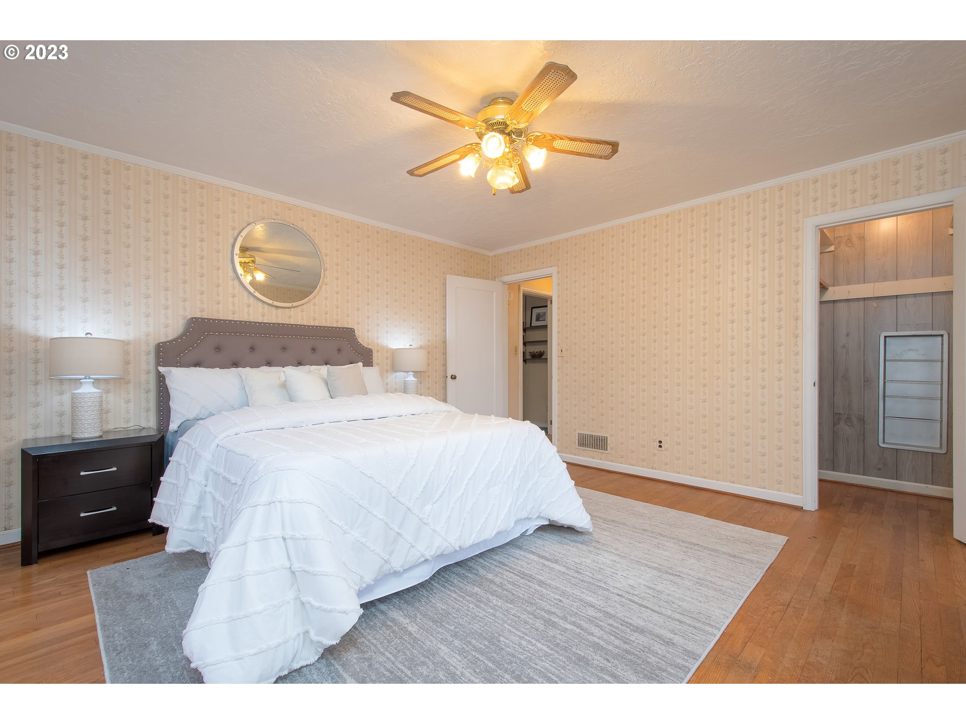 110 Northwest 12th Street Gresham, OR 97030 - Photo 29 of 43 a bedroom with a bed and wooden floor
