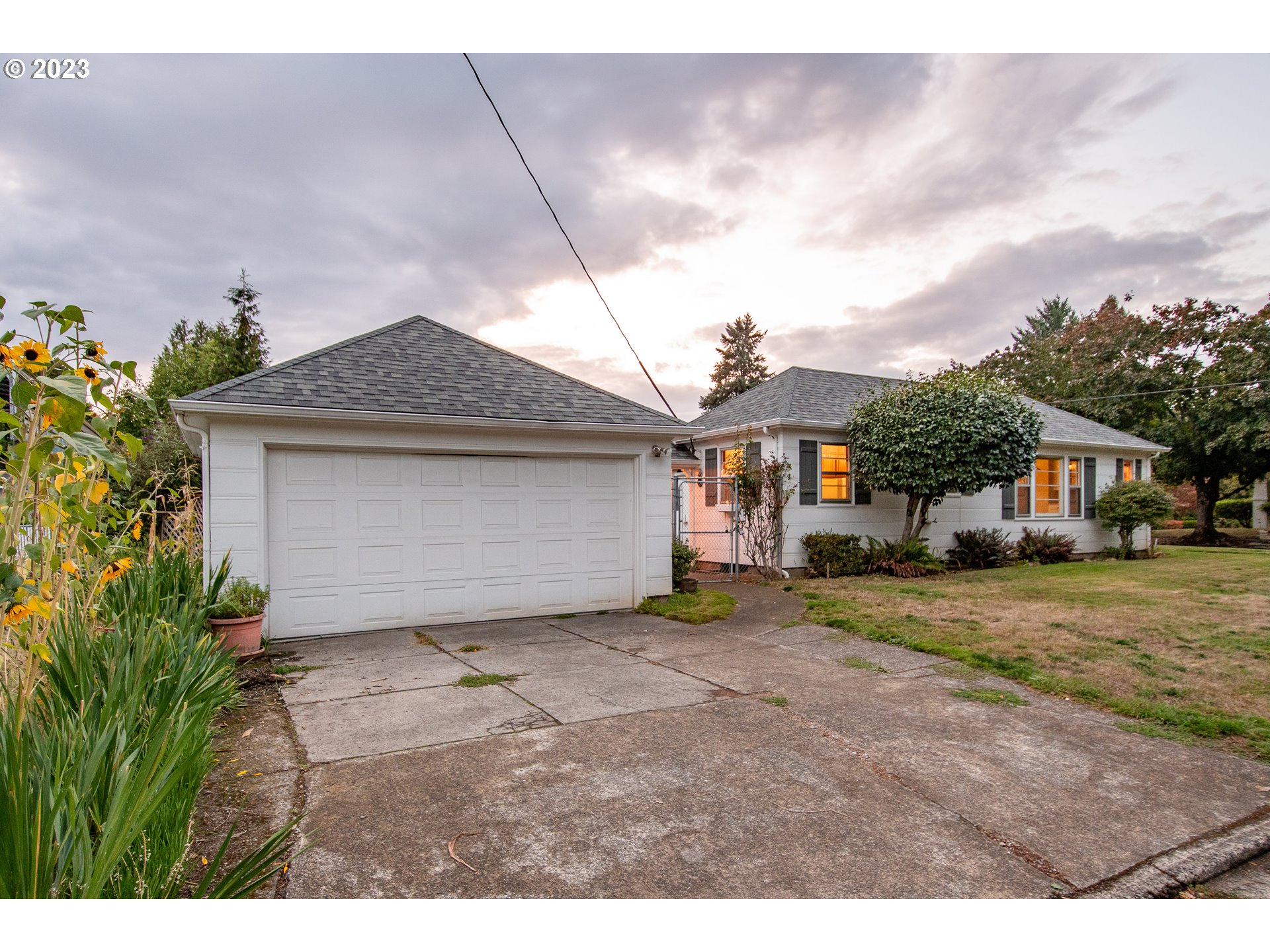 110 Northwest 12th Street Gresham, OR 97030 - Photo 42 of 43 a front view of a house with a yard and garage