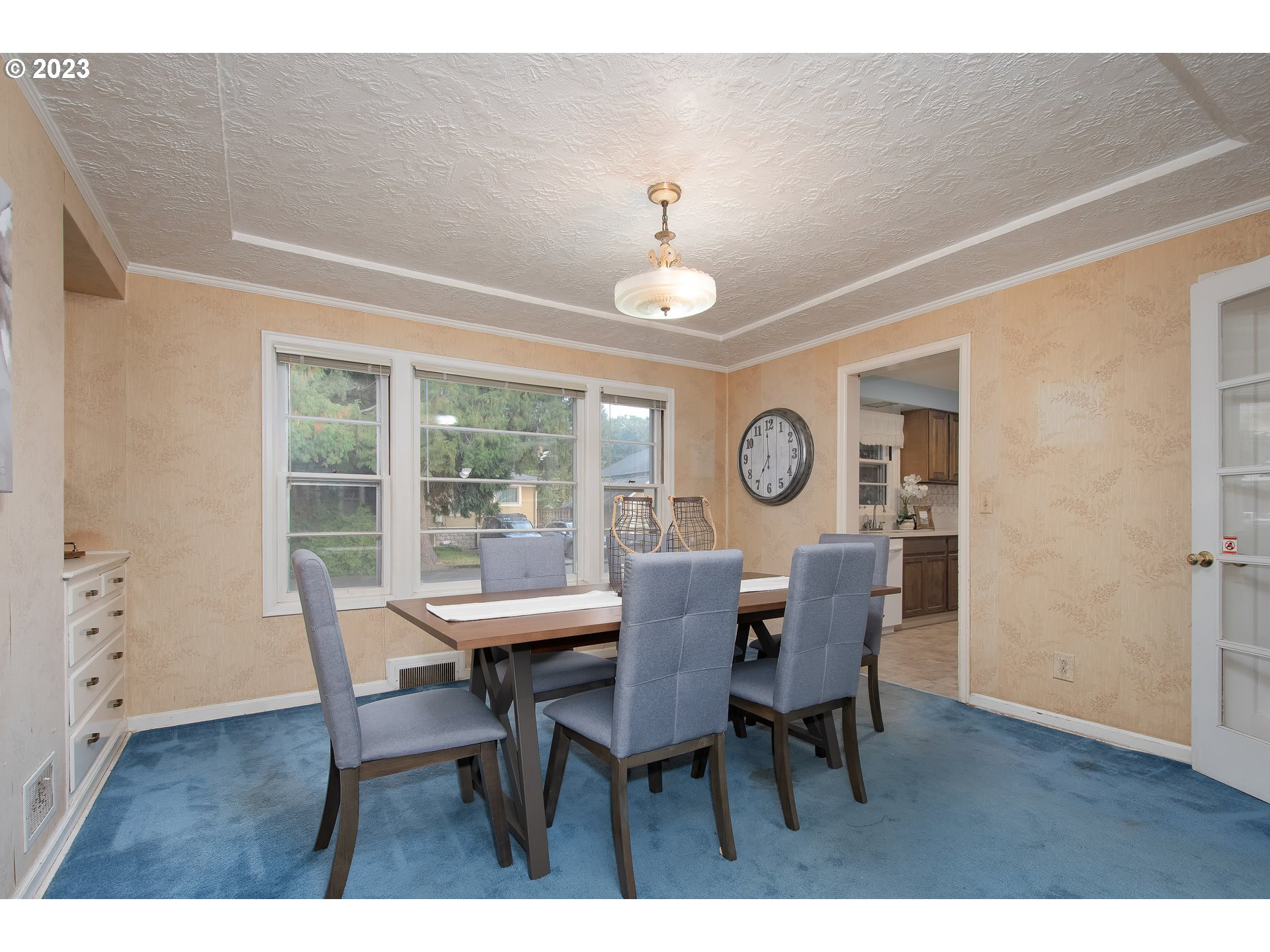 110 Northwest 12th Street Gresham, OR 97030 - Photo 10 of 43 a dining room with furniture a chandelier and wooden floor