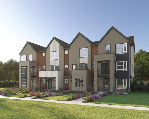 a front view of building with yard and garage