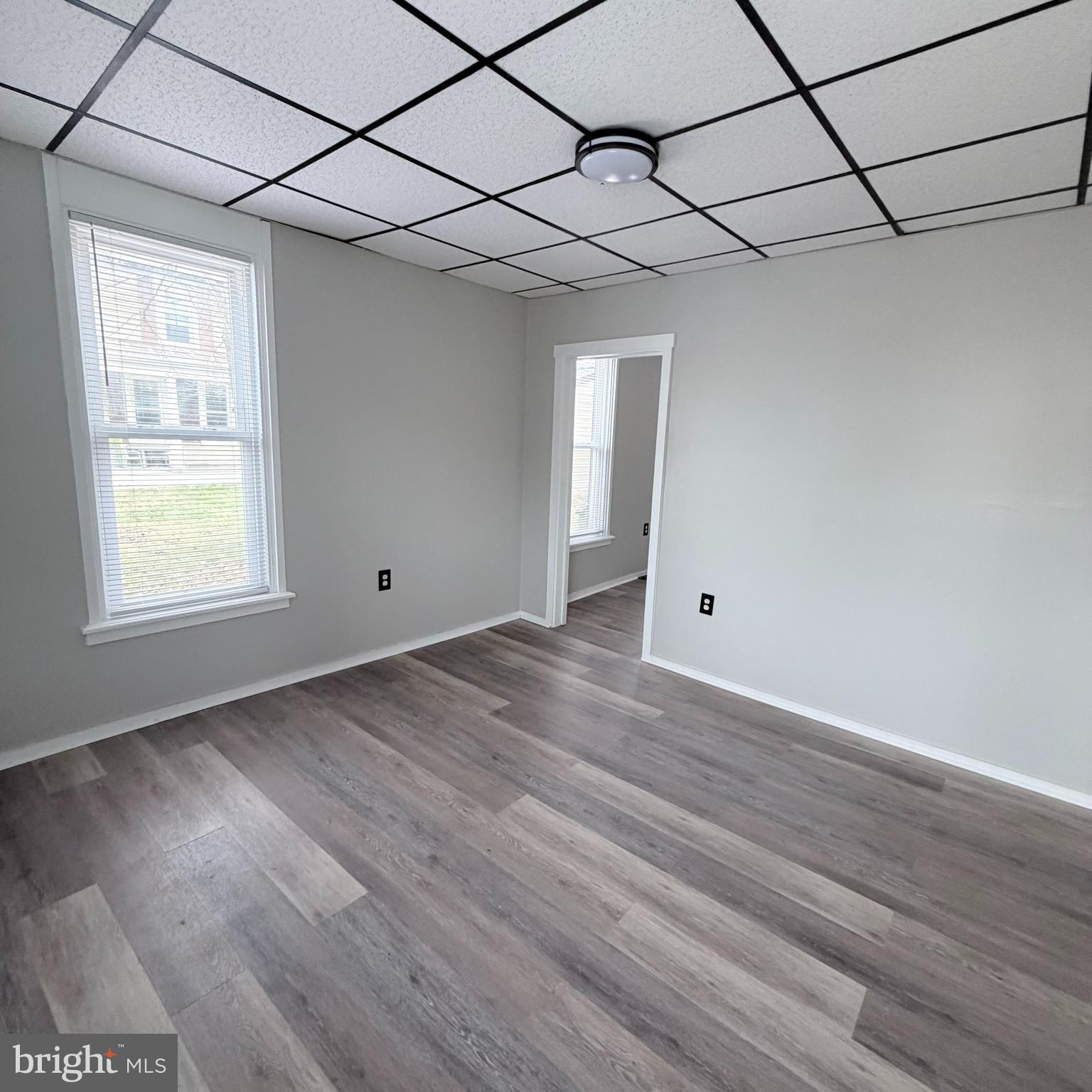 980 Scotland Avenue, Unit DOWNSTAIRS Chambersburg, PA 17201 - Photo 2 of 12 a view of empty room with wooden floor and fan