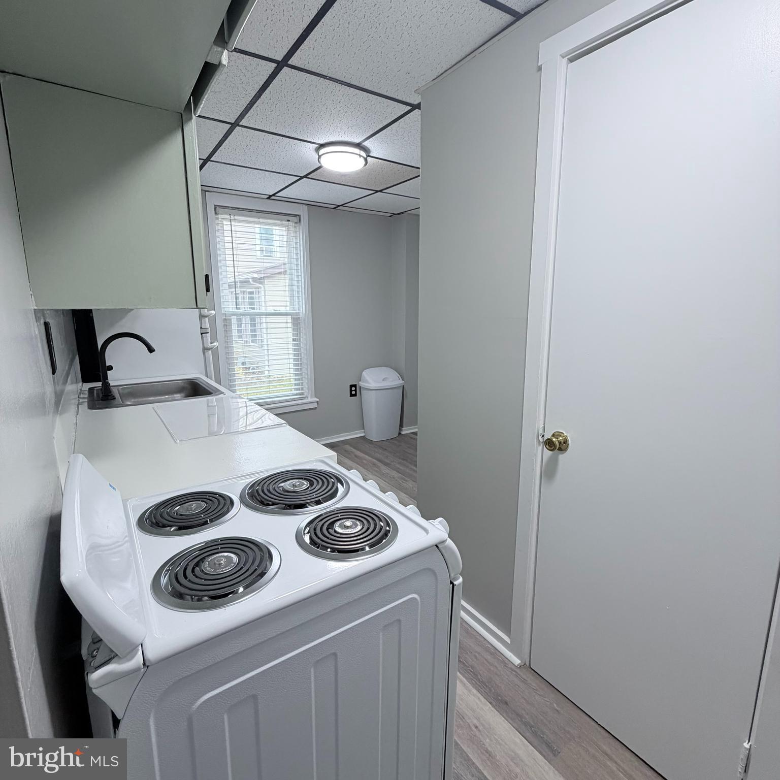 980 Scotland Avenue, Unit DOWNSTAIRS Chambersburg, PA 17201 - Photo 6 of 12 a kitchen with a sink a stove and cabinets