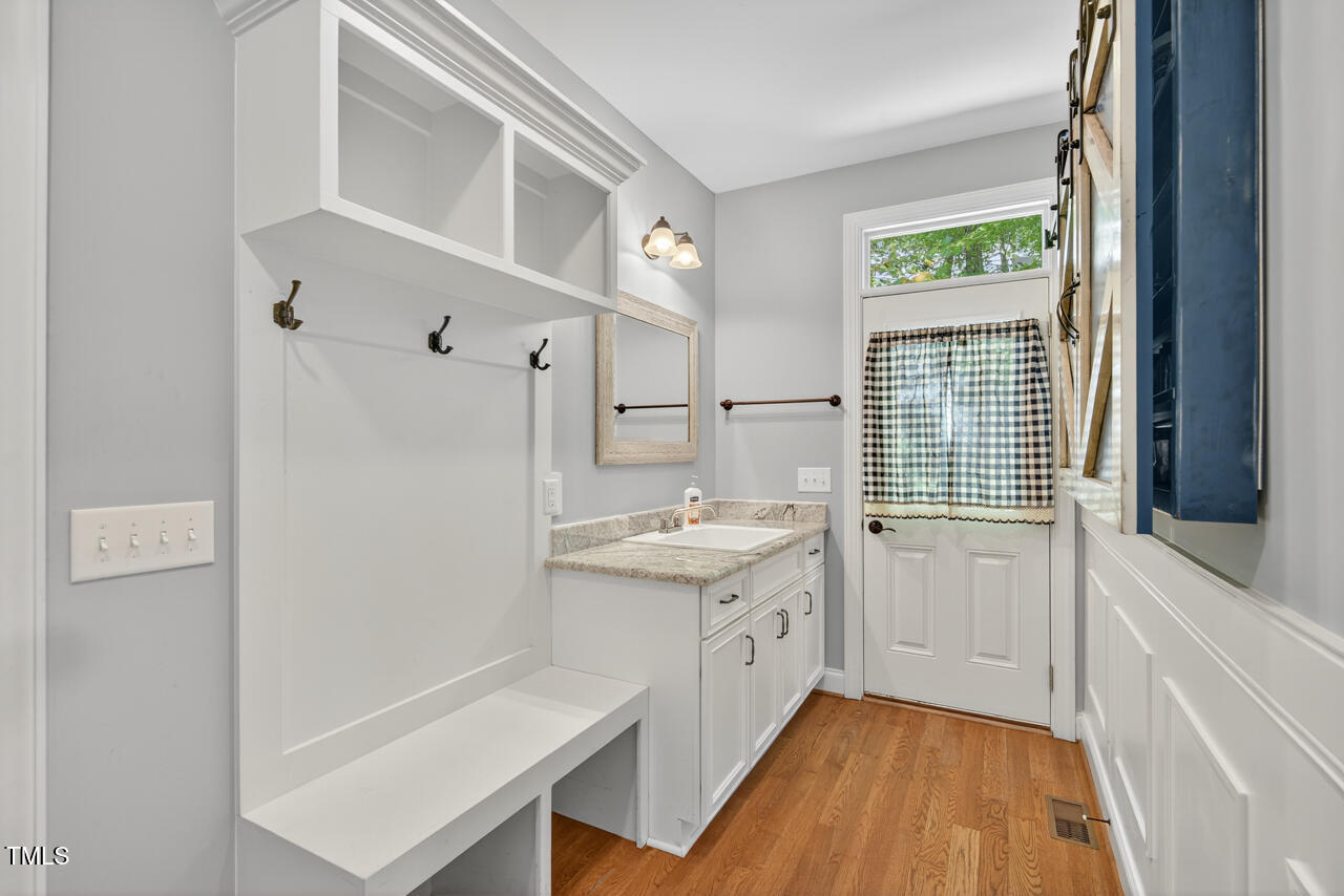 67 Ada Court Pittsboro, NC 27312 - Photo 25 of 63 a kitchen with a sink a stove a refrigerator and a window