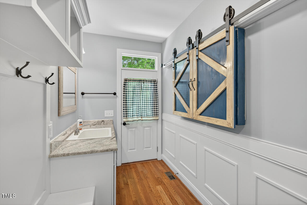 67 Ada Court Pittsboro, NC 27312 - Photo 26 of 63 a bathroom with a sink a mirror and a bathtub