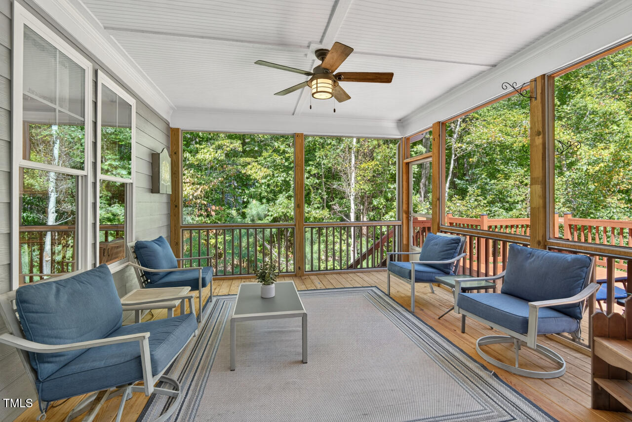 67 Ada Court Pittsboro, NC 27312 - Photo 27 of 63 a living room with furniture and a floor to ceiling window
