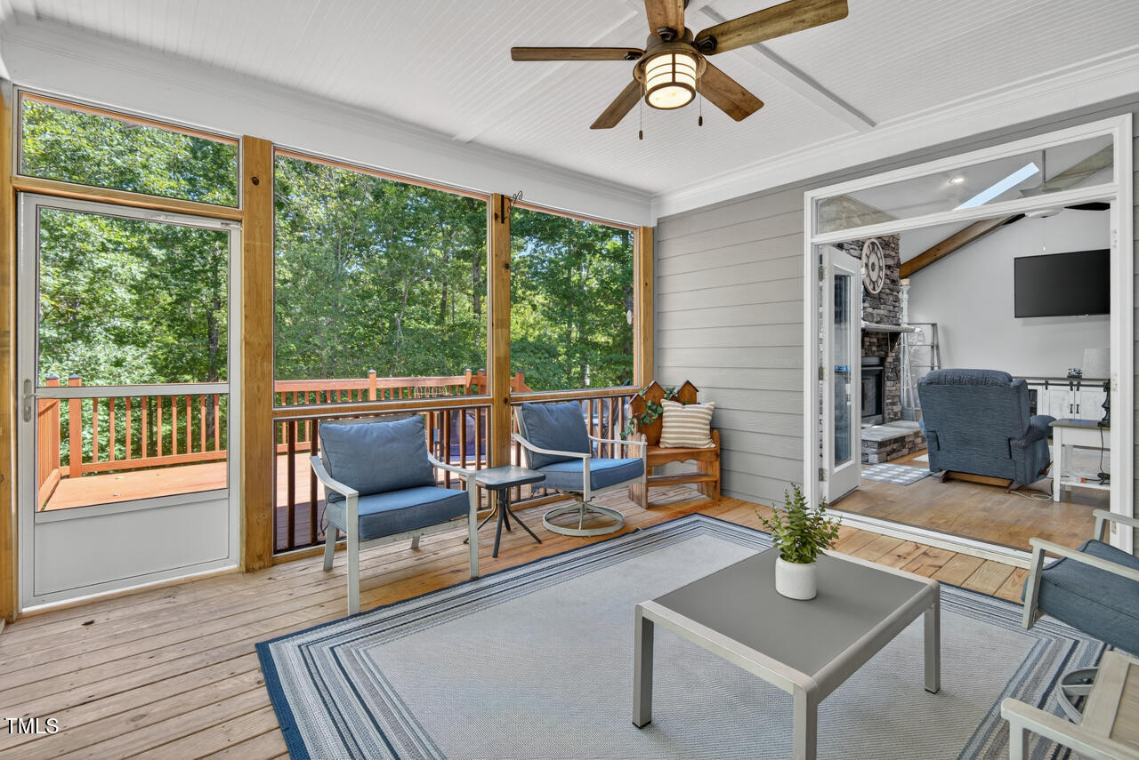 67 Ada Court Pittsboro, NC 27312 - Photo 28 of 63 a living room with furniture and a large window