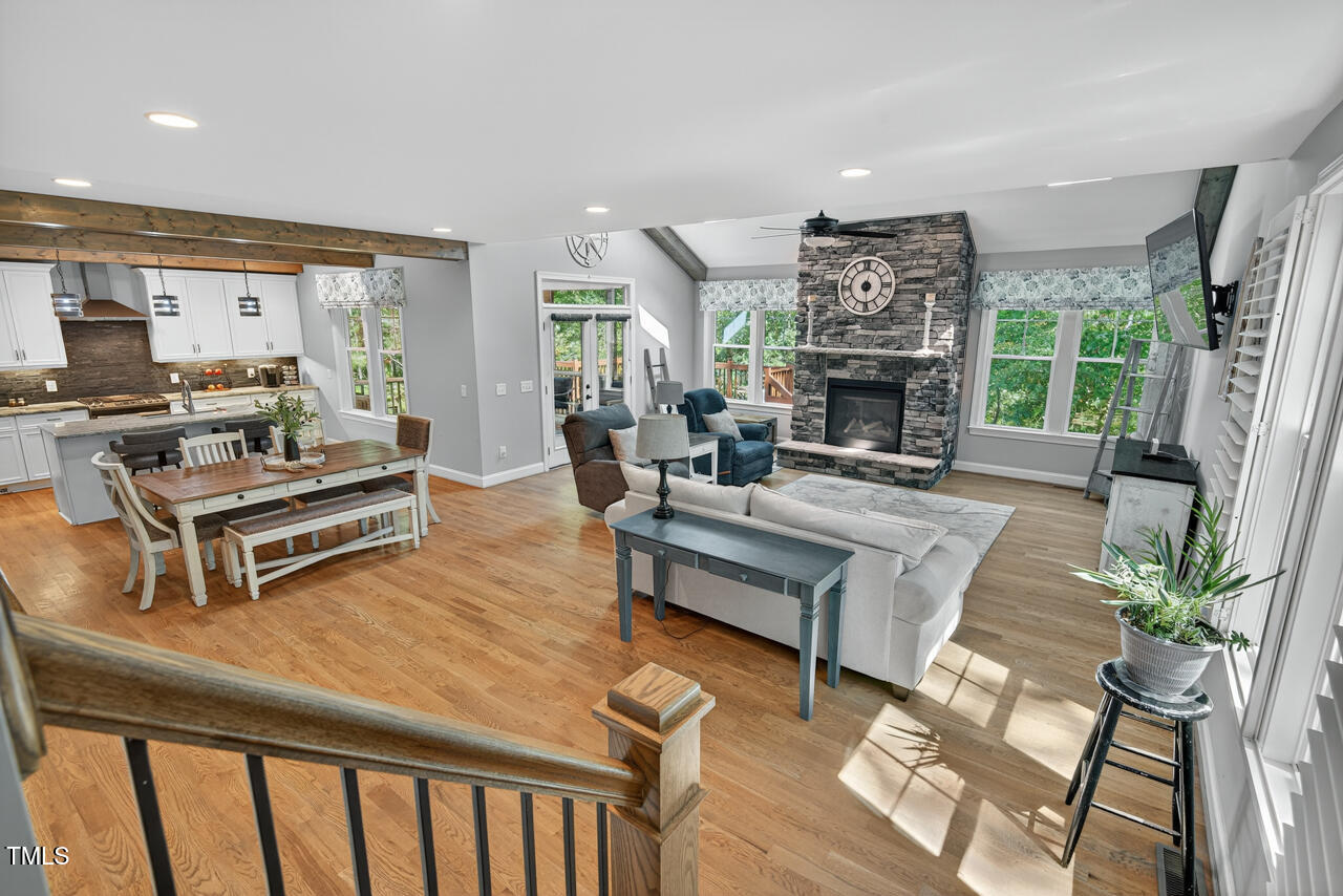 67 Ada Court Pittsboro, NC 27312 - Photo 30 of 63 a living room with furniture a fireplace and a potted plant