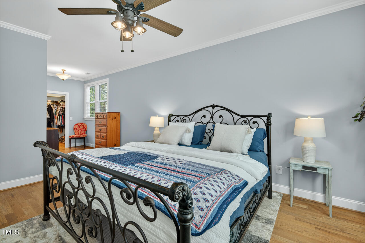 67 Ada Court Pittsboro, NC 27312 - Photo 34 of 63 a bedroom with a bed and wooden floor