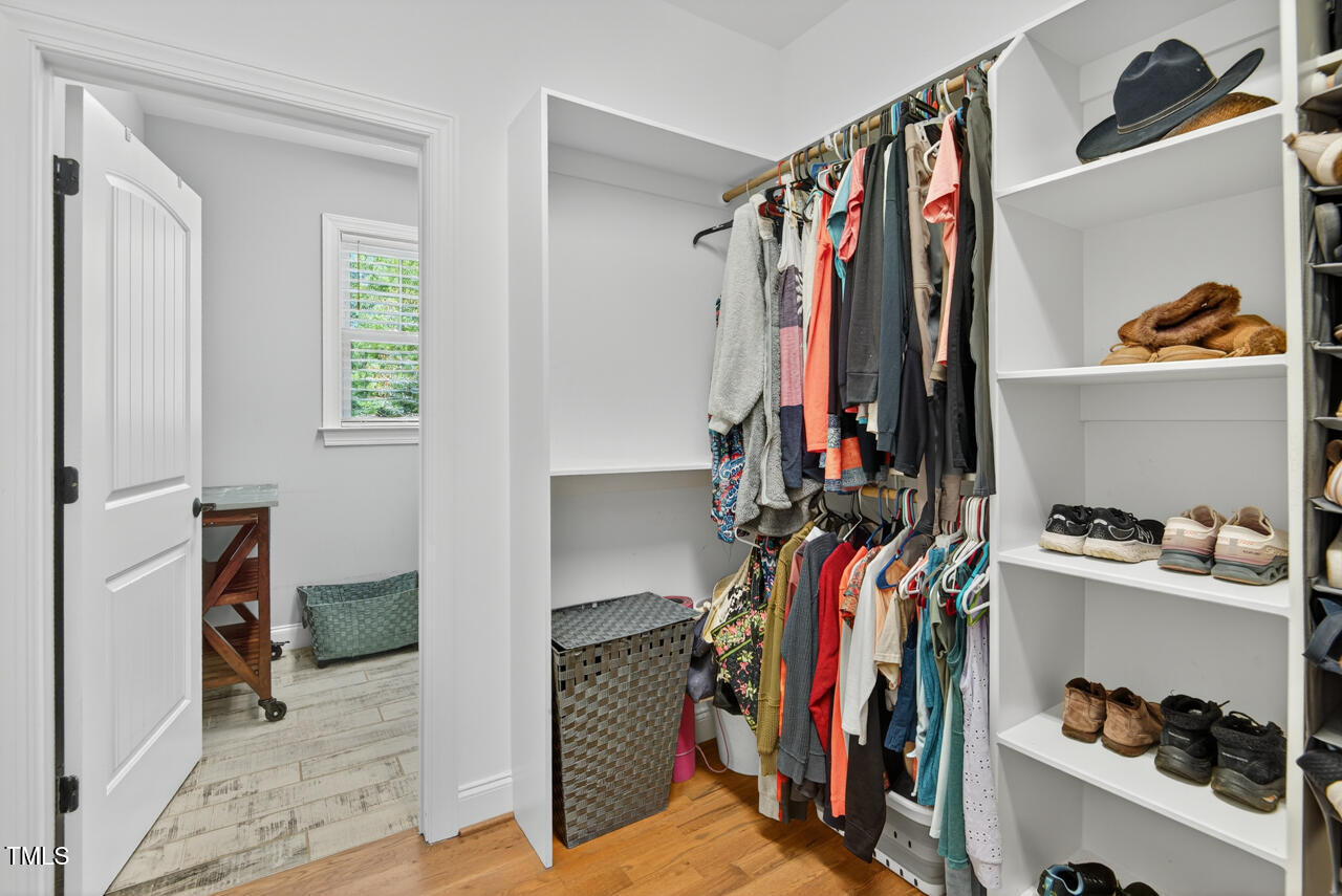 67 Ada Court Pittsboro, NC 27312 - Photo 37 of 63 a view of walk in closet with clothes and shoes