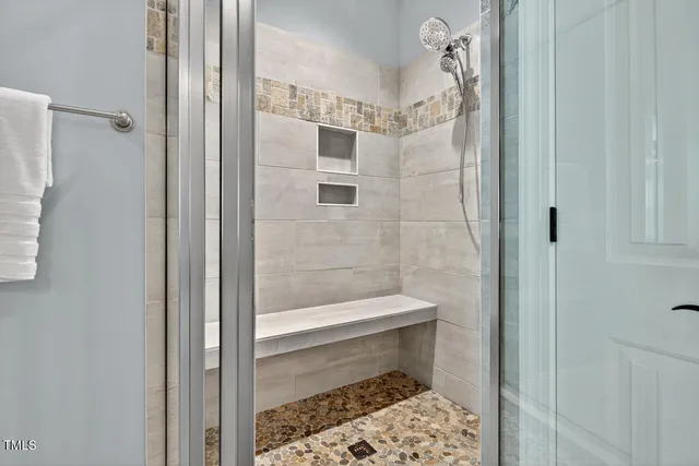 a bathroom with a sink double vanity and a mirror
