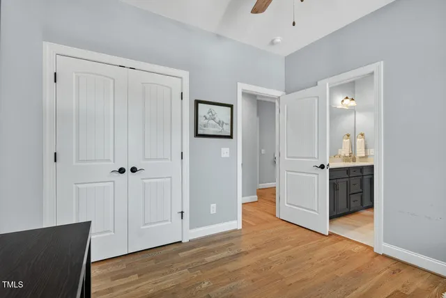 a view of a backyard with table and chairs and potted plants