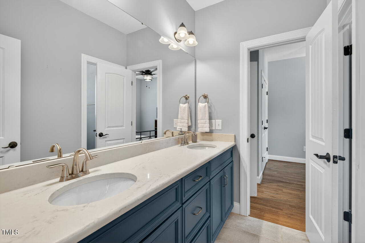 67 Ada Court Pittsboro, NC 27312 - Photo 47 of 63 a bathroom with a sink double vanity and a mirror