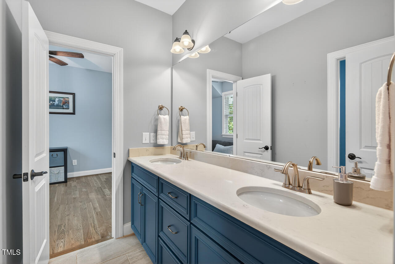 67 Ada Court Pittsboro, NC 27312 - Photo 48 of 63 a bathroom with a double vanity sink mirror and double