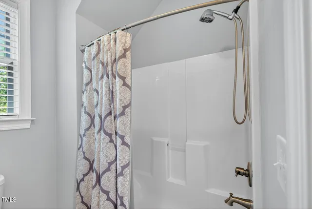 an aerial view of a house with a yard and garden