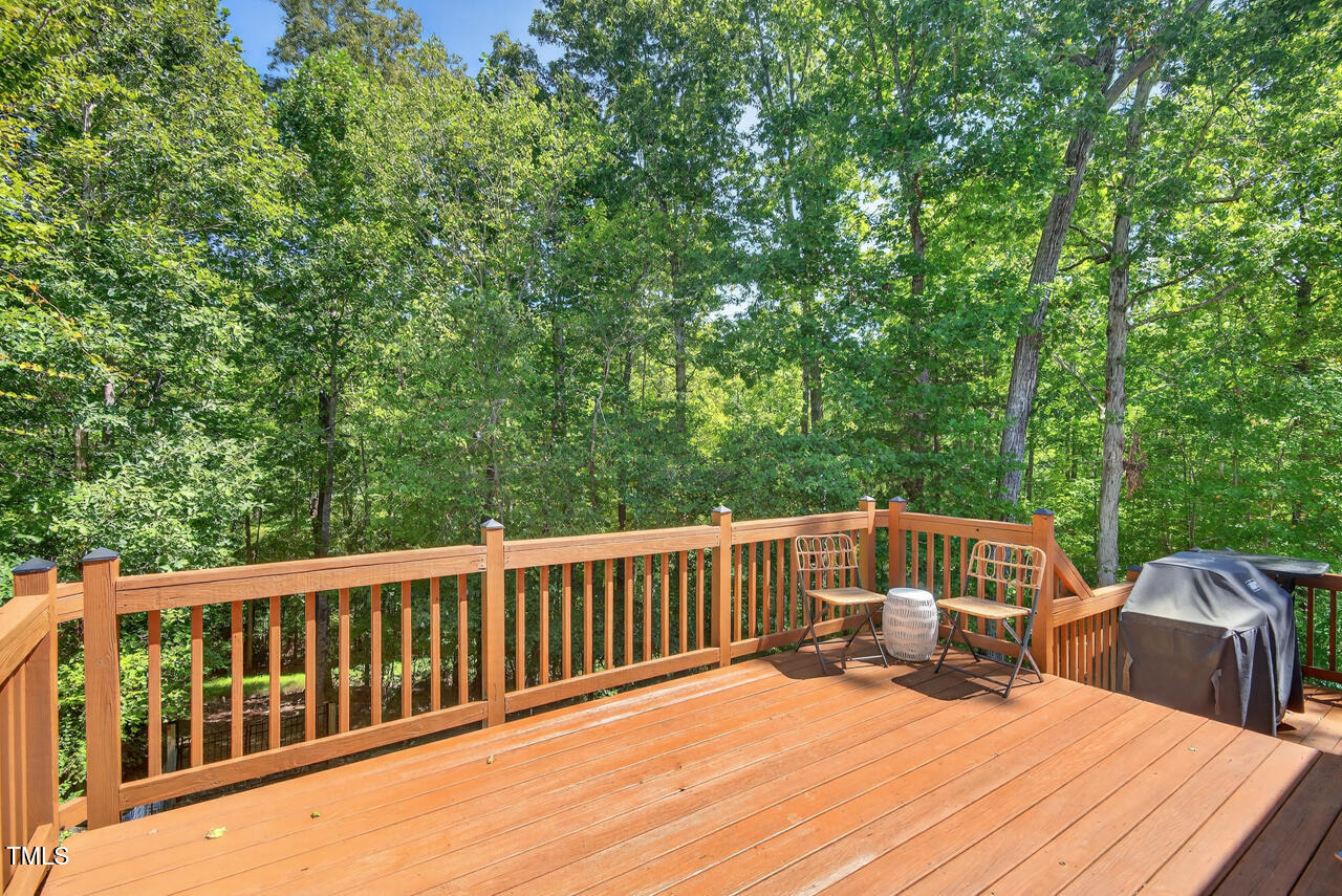 67 Ada Court Pittsboro, NC 27312 - Photo 52 of 63 a view of a deck with two chairs and wooden floor