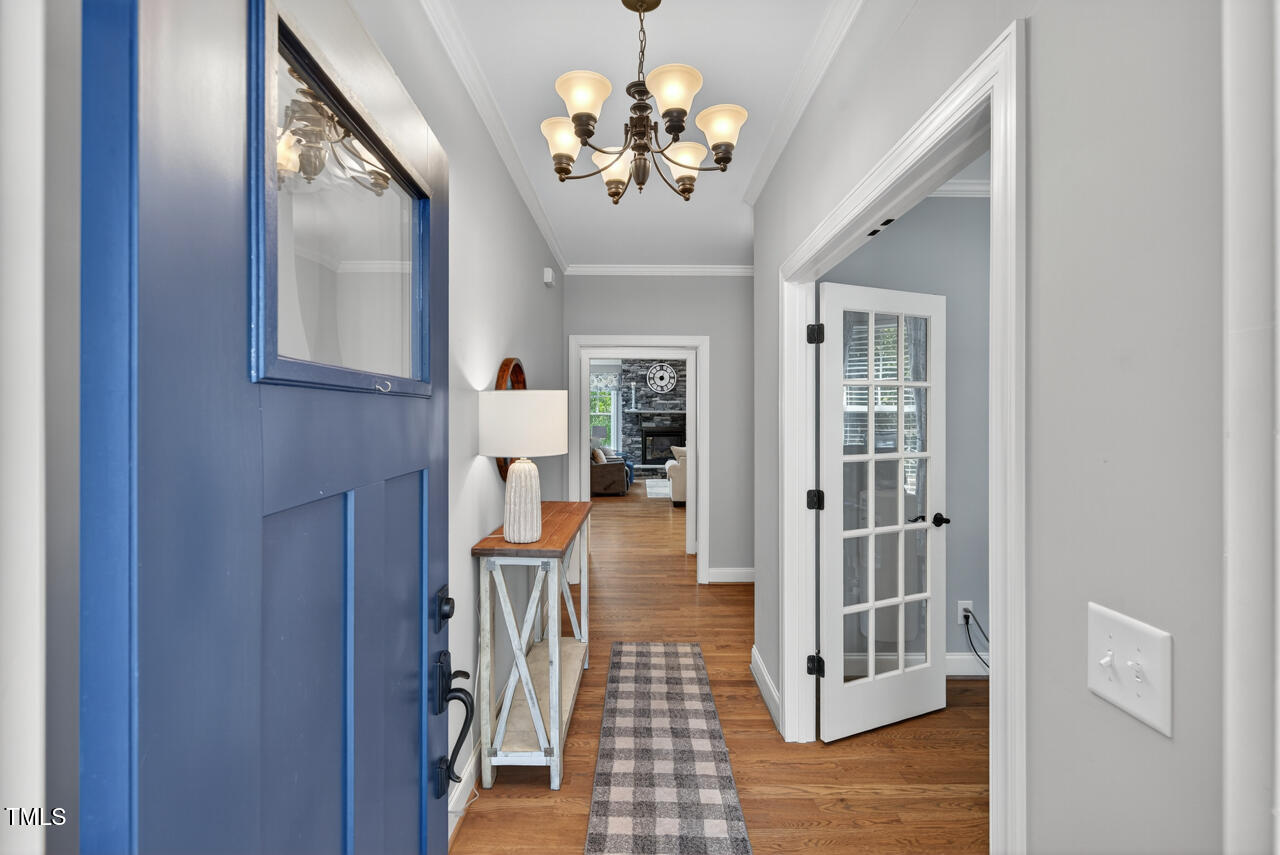 67 Ada Court Pittsboro, NC 27312 - Photo 8 of 63 a view of a hallway with a chandelier