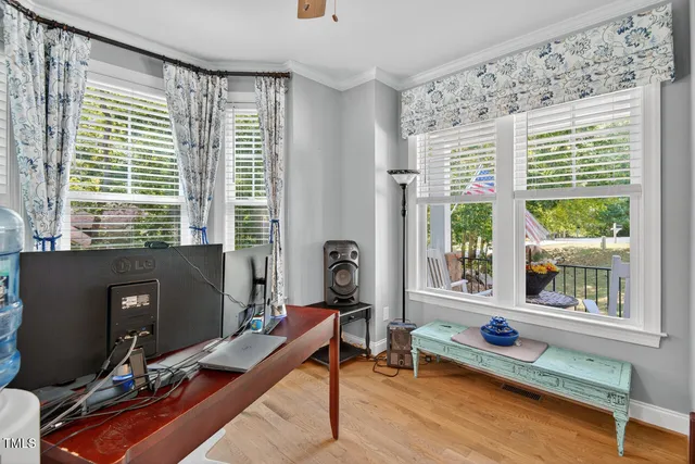 a bathroom with a sink and mirror with bathtub