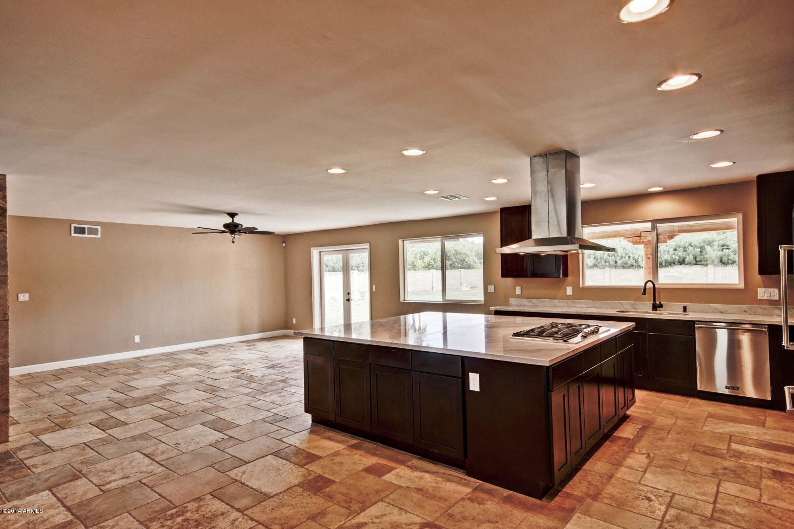 5227 East Osborn Road Phoenix, AZ 85018 - Photo 17 of 46 a kitchen with stainless steel appliances granite countertop a stove a sink and a refrigerator
