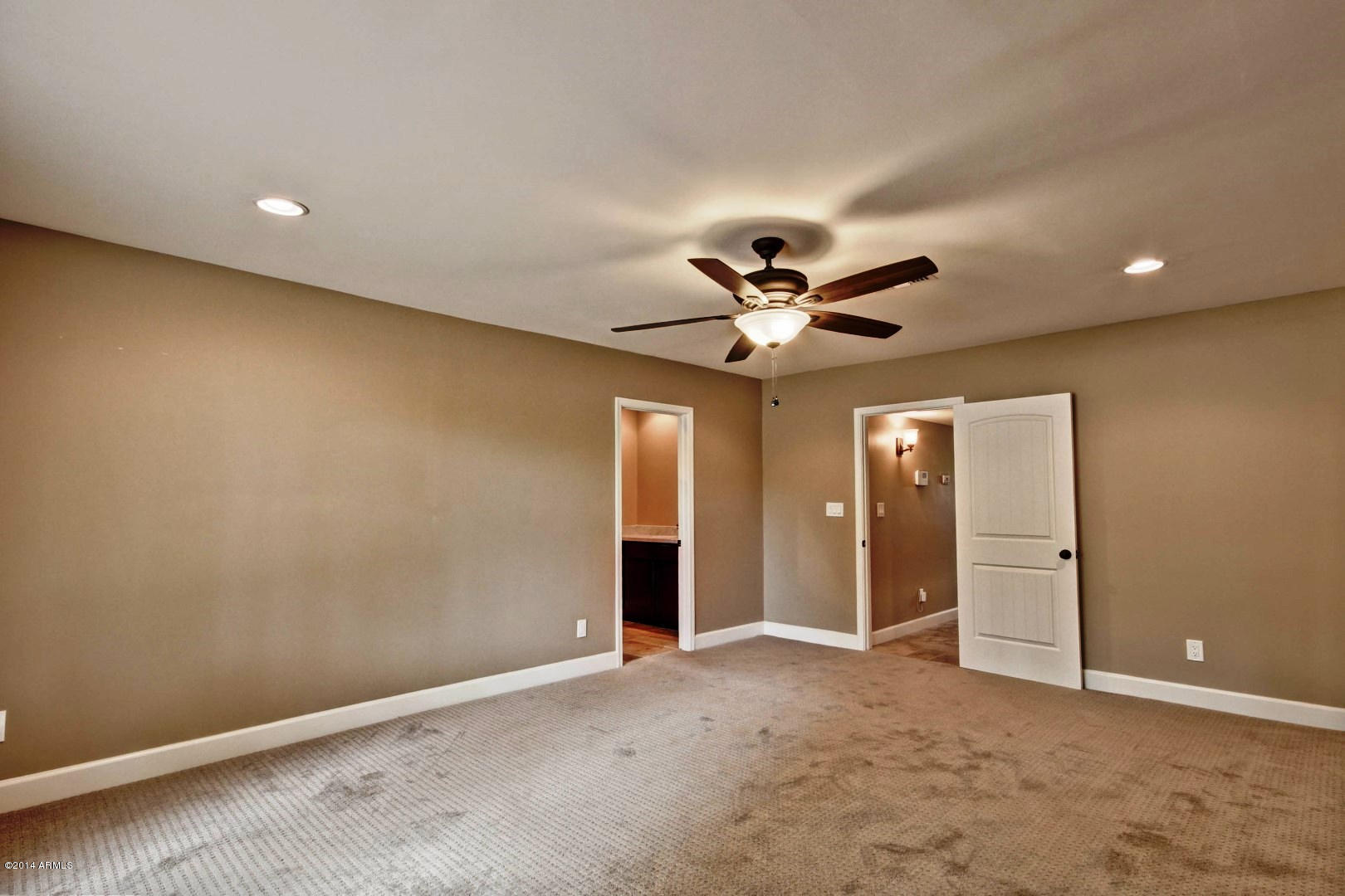 5227 East Osborn Road Phoenix, AZ 85018 - Photo 26 of 46 a view of a livingroom with a chandelier fan and windows