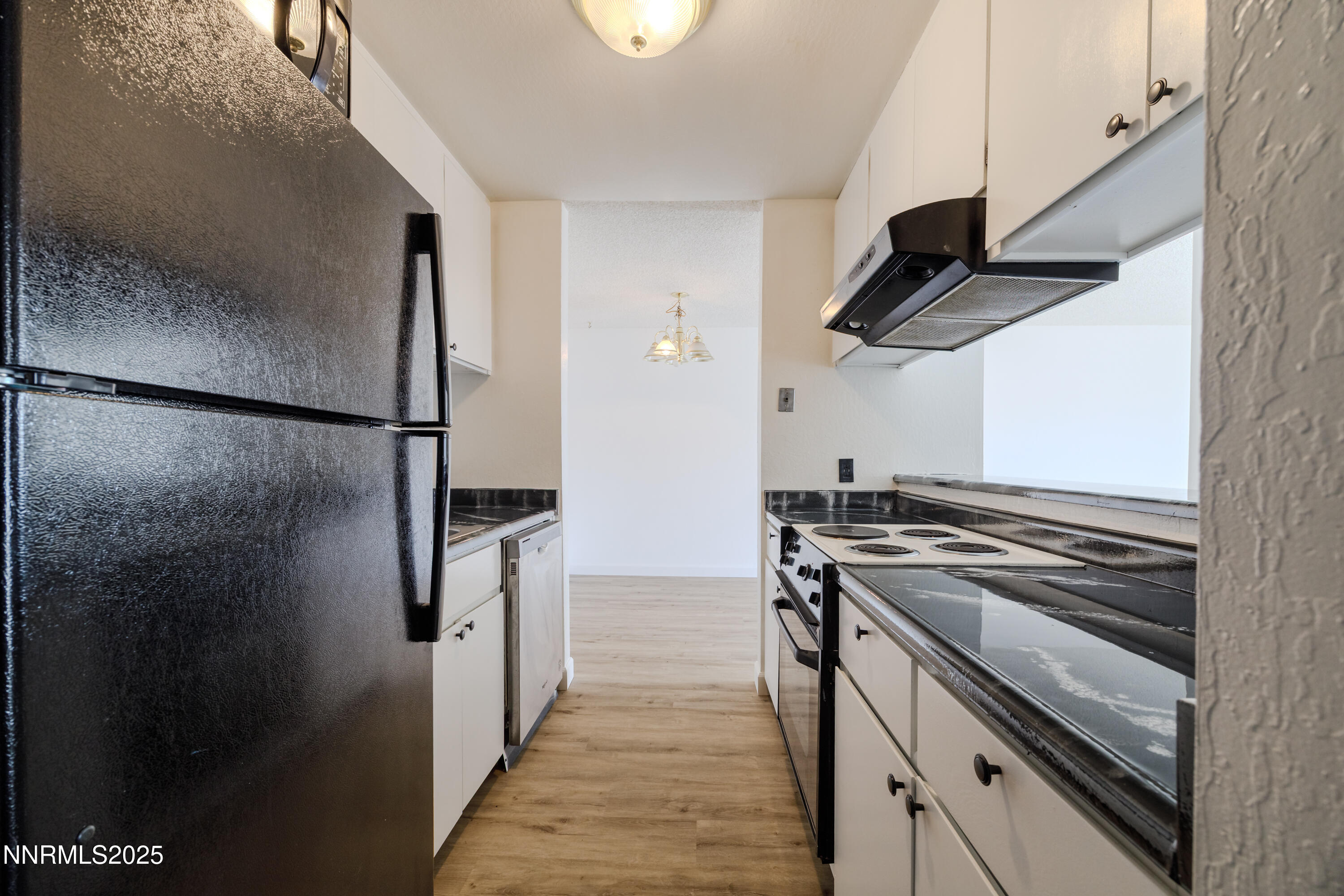 1000 Beck Drive, Unit 276 Reno, NV 89509 - Photo 3 of 10 a kitchen with stainless steel appliances a refrigerator a stove and a refrigerator