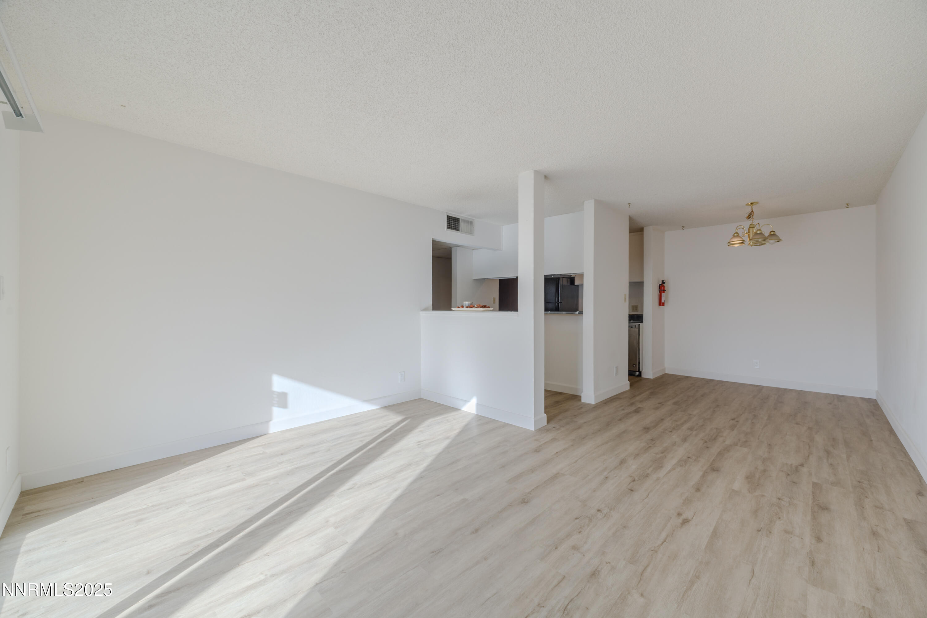 1000 Beck Drive, Unit 276 Reno, NV 89509 - Photo 5 of 10 a view of a big room with wooden floor and windows