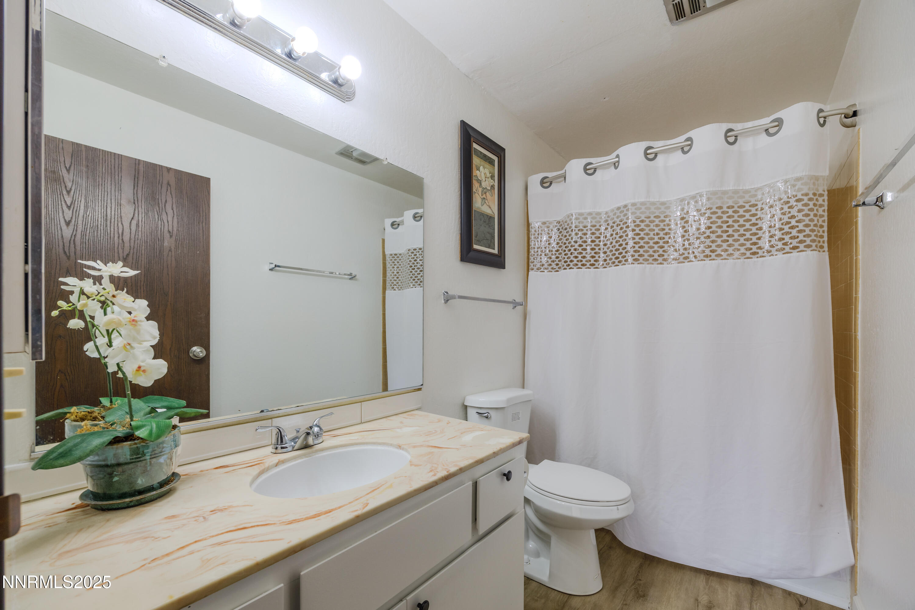 1000 Beck Drive, Unit 276 Reno, NV 89509 - Photo 6 of 10 a bathroom with a granite countertop sink and a mirror