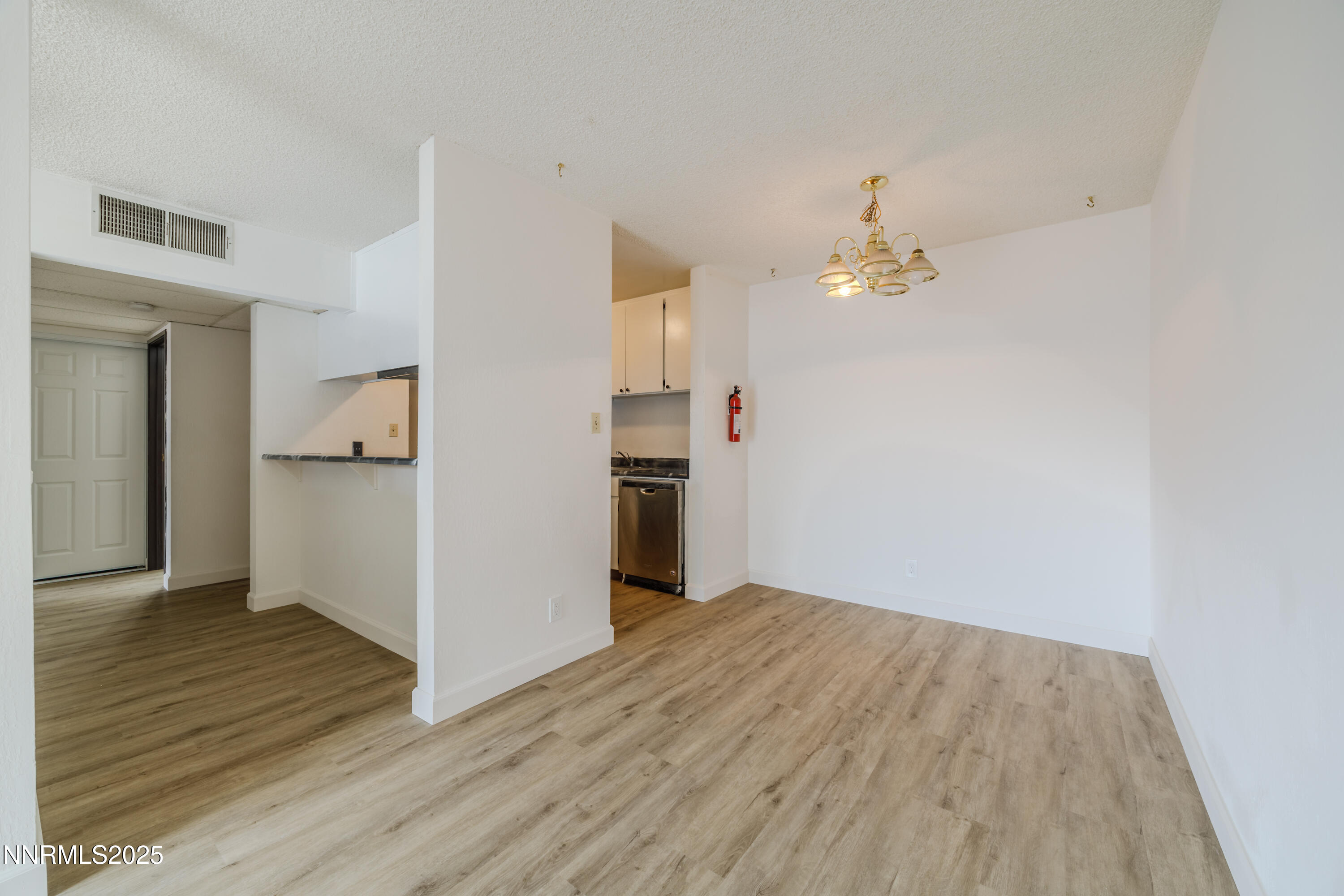 1000 Beck Drive, Unit 276 Reno, NV 89509 - Photo 8 of 10 a view of a kitchen with wooden floor and a ceiling fan