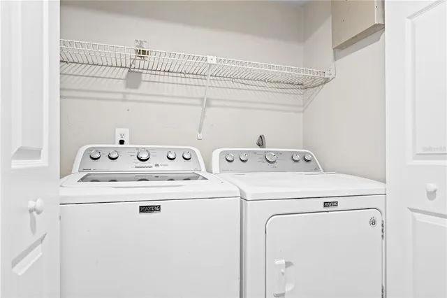 a utility room with dryer and washer